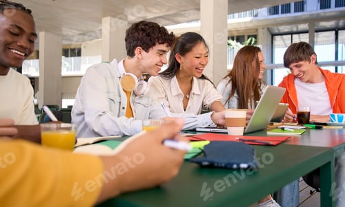 Preview: Group of cheerful high school students gather in college cafeteria to work and discuss topic test.