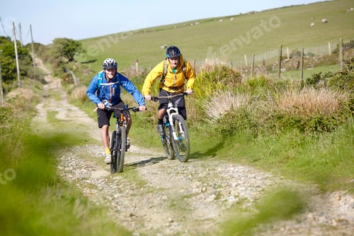 Preview: Cyclists cycling on dirt track