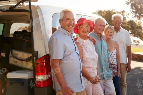 Preview: Portrait Of Senior Friends Standing Together Beside Van On Vacation