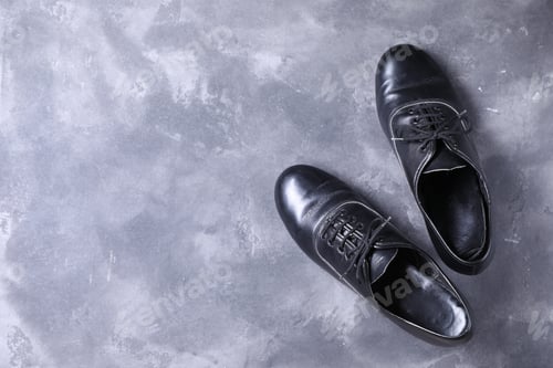 Preview: Pair of shoes for tap dance on grey surface, top view. Space for text