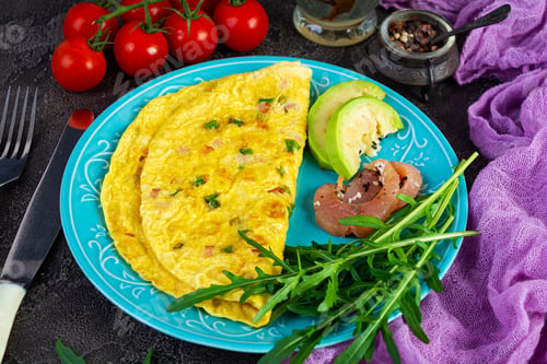 Preview: Fried omelette with ham, onion and herbs. Breakfast with scrambled eggs