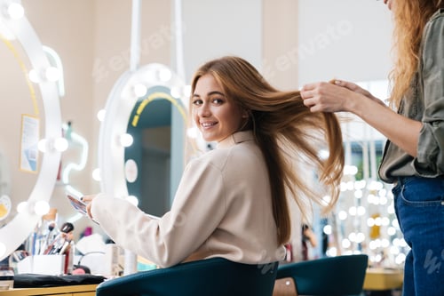 Preview: Woman Styling Hair in Beauty Salon, Smiling