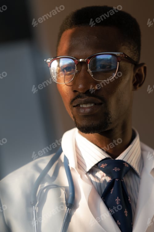 Preview: Handsome Guy Doctor In White Lab Coat With Stethoscope On White Background