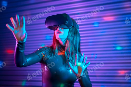 Preview: Female gamer wearing augmented reality goggles in a futuristic space