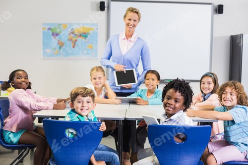 Preview: Portrait of teacher and kids in classroom