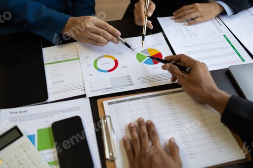 Preview: Meeting with financial advisors to analyze production costs and analyze marketing charts.