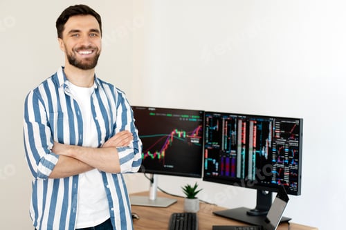 Preview: Smiling trader holding arms crossed in modern office, monitors with crypto chart on background