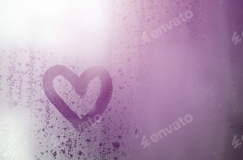 Preview: The heart is painted on the misted glass in winter