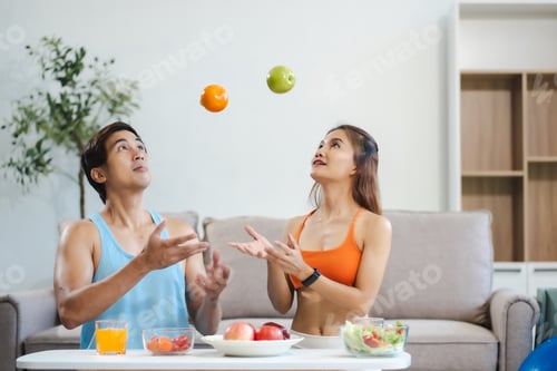 Preview: Fit couple enjoys healthy fruit breakfast after yoga training.