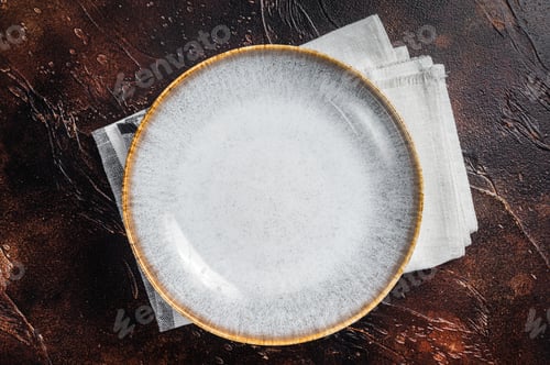 Preview: Table setting with vintage empty white plate on rustic wood. Dark background. Top view. Copy space