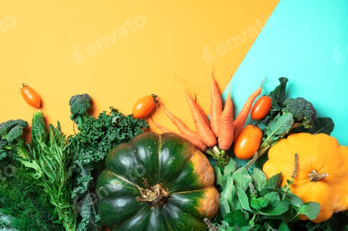 Preview: Autumn vegetables on trendy yellow and green background. Top view. Vegan and vegetarian diet