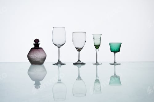 Preview: Closeup shot of different glasses reflection on the table background