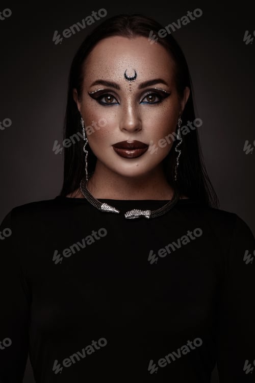Preview: Beautiful caucasian woman with creative makeup and dark lips. Beauty face. Art makeup.