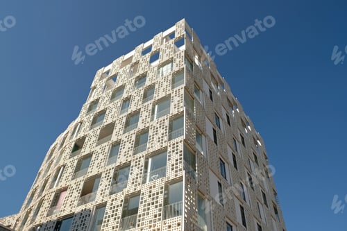 Preview: Exterior of modern white openwork house. Architectural detail of close-up on texture wall