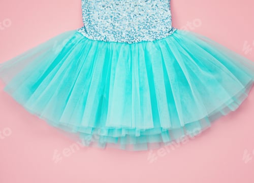 Preview: Top view over the girl ballet tutu dress over the pink background