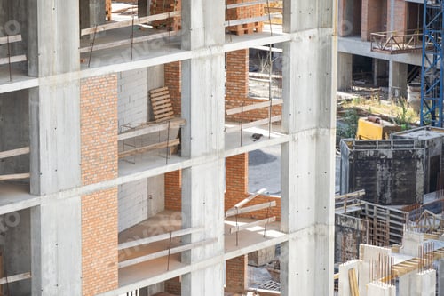 Preview: View of a large construction site with buildings under construction and multi-storey residential