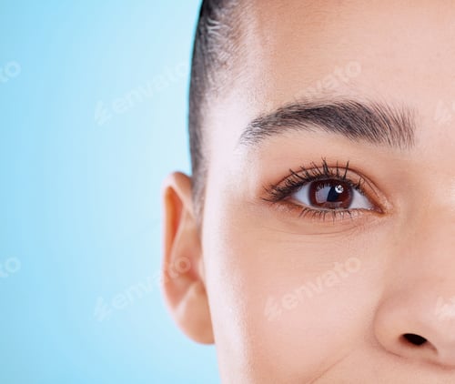 Preview: Studio portrait of an attractive young woman posing against a blue background