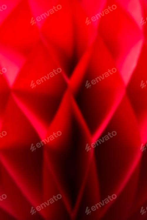 Preview: Detail of the blurred red honeycomb paper ball decoration
