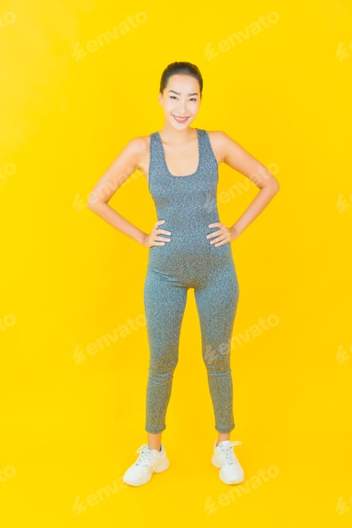 Preview: Young Woman in Athletic Wear on Yellow Background
