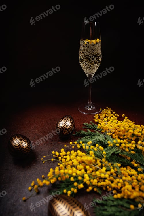 Preview: Elegant Easter celebration with champagne and mimosa flowers