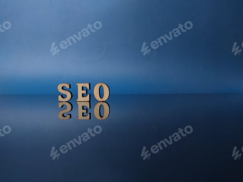 Preview: Wooden word with word SEO on a black acrylic board with reflection