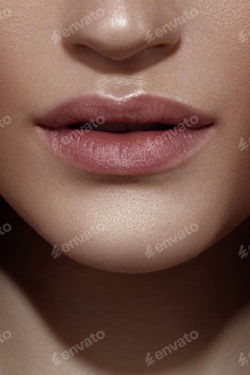 Preview: Close-up of female lips with natural makeup highlighting smooth skin texture