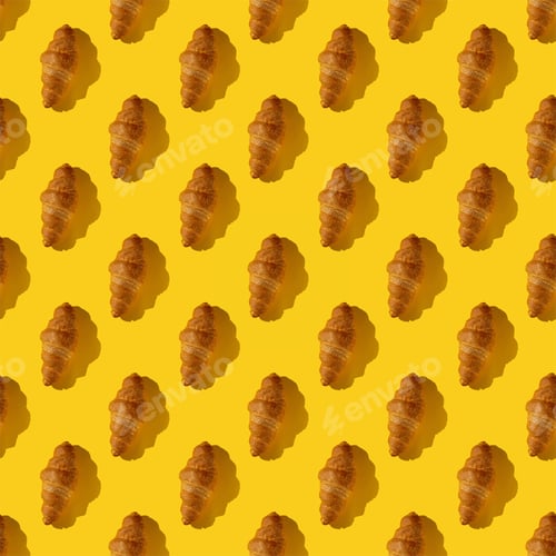 Preview: seamless pattern of croissant on a yellow background with hard light