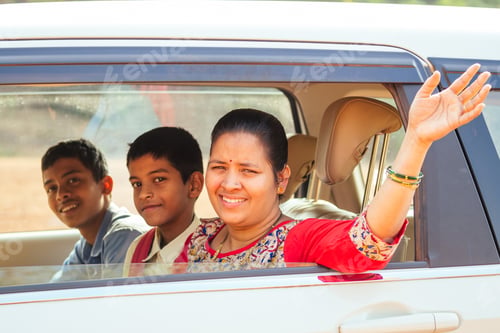 Preview: indian family driving boys to school In front of house gates