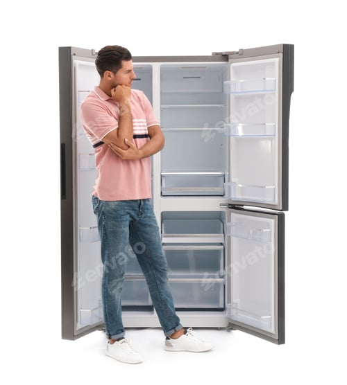 Preview: Man near empty refrigerator on white background