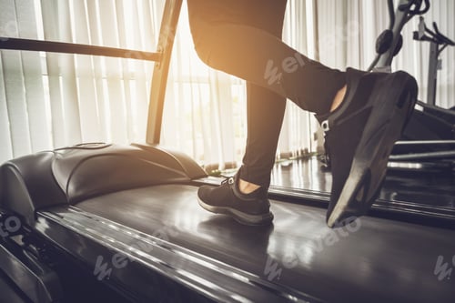 Preview: Healthy People running on machine treadmill at fitness gym