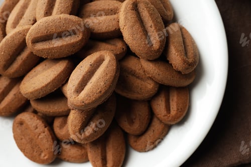 Preview: Concept of tasty snack for hot drink - cookies in the shape of coffee seeds