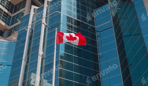 Preview: Flag of Canada flying against a blue sky.