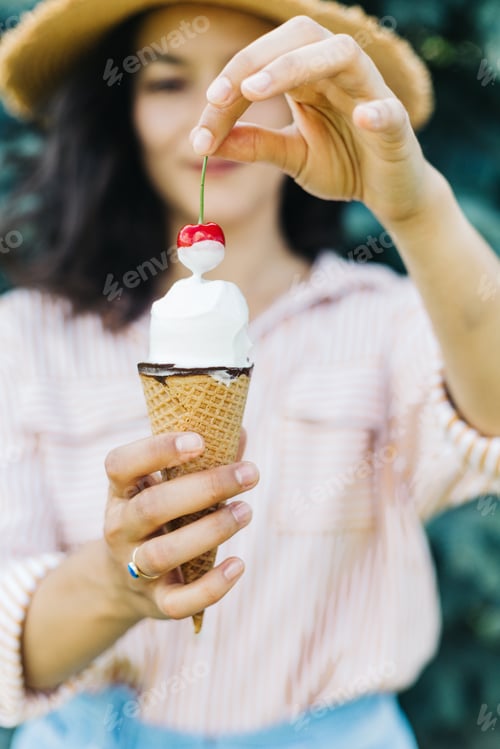 Preview: Woman Enjoys Ice Cream in Outdoors Setting