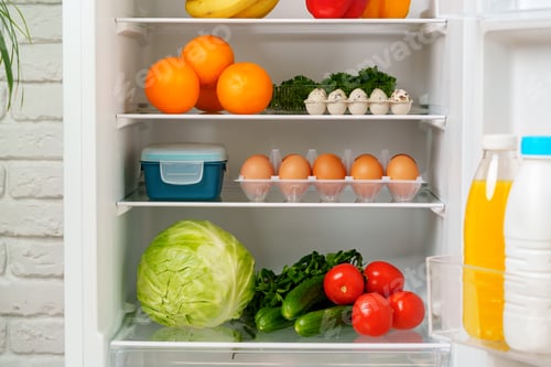 Preview: White Refrigerator Open With Fresh Produce and Dairy