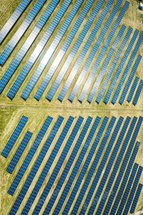 Preview: Solar panels on green field, aerial view