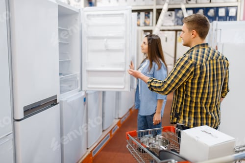 Preview: Couple choosing refrigerator in electronics store