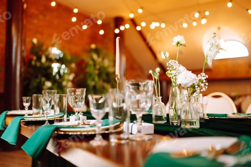 Preview: Floral decorations on the banquet table in the restaurant. Wedding, birthday, party, event concept.