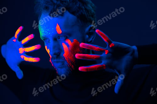 Preview: Caucasian male model with blacklight paint.