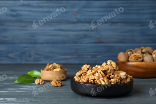 Preview: Composition with walnuts in dish on table. Space for text
