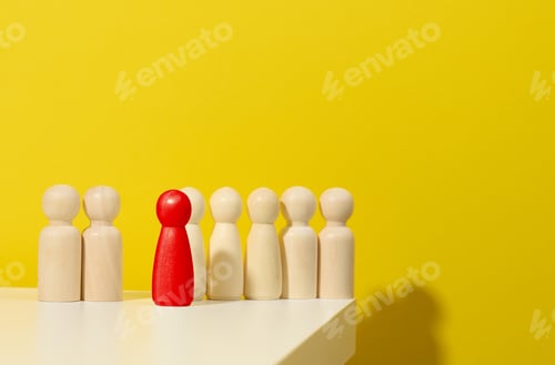 Preview: Wooden figurines of men and one red on a blue background