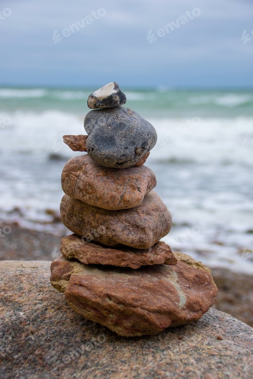 Preview: Cairn on a rock at the beach
