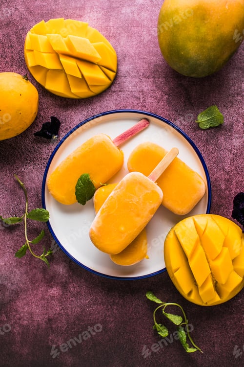 Preview: Mango banana popsicles with fresh fruits, flat lay top view