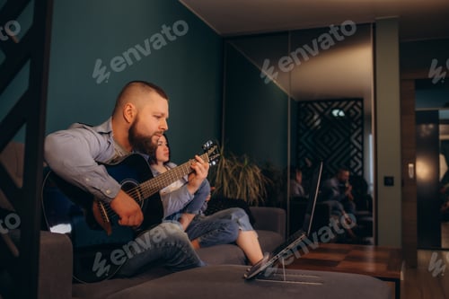 Preview: Man Plays Guitar for Partner at Home