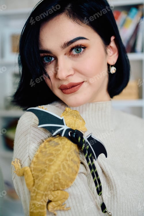 Preview: Beautiful Woman Posing with Her Adorable Bearded Dragon Pets