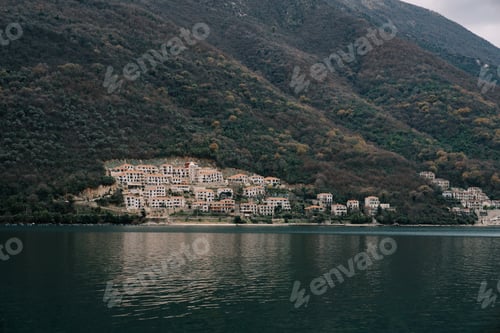 Preview: Residential buildings in Kostanjica at the foot of the green mountains. Kotor Bay, Montenegro