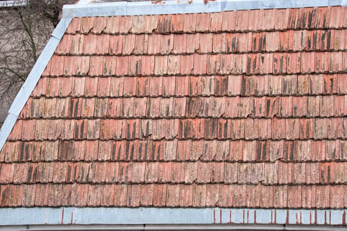 Preview: Closeup surface of old weathered ceramic tiles covering building roof