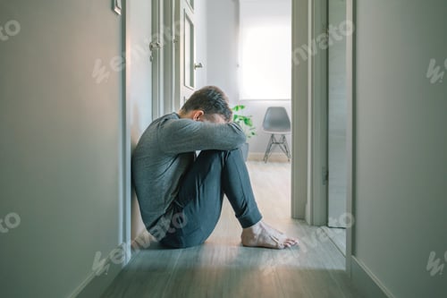 Preview: Man with mental disorder and suicidal thoughts crying sitting on the floor