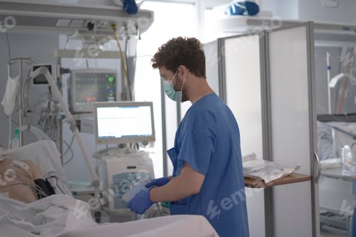 Preview: Doctor caring for patient in intensive care unit