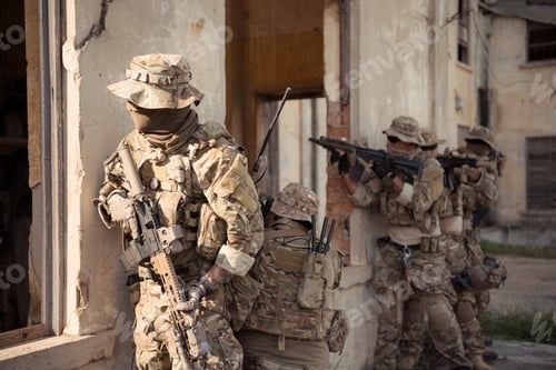Preview: Professional marine soldiers training with weapon on a military range.