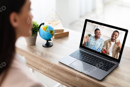 Preview: Tour Agent At Laptop Having Video Call Consulting Couple Indoor